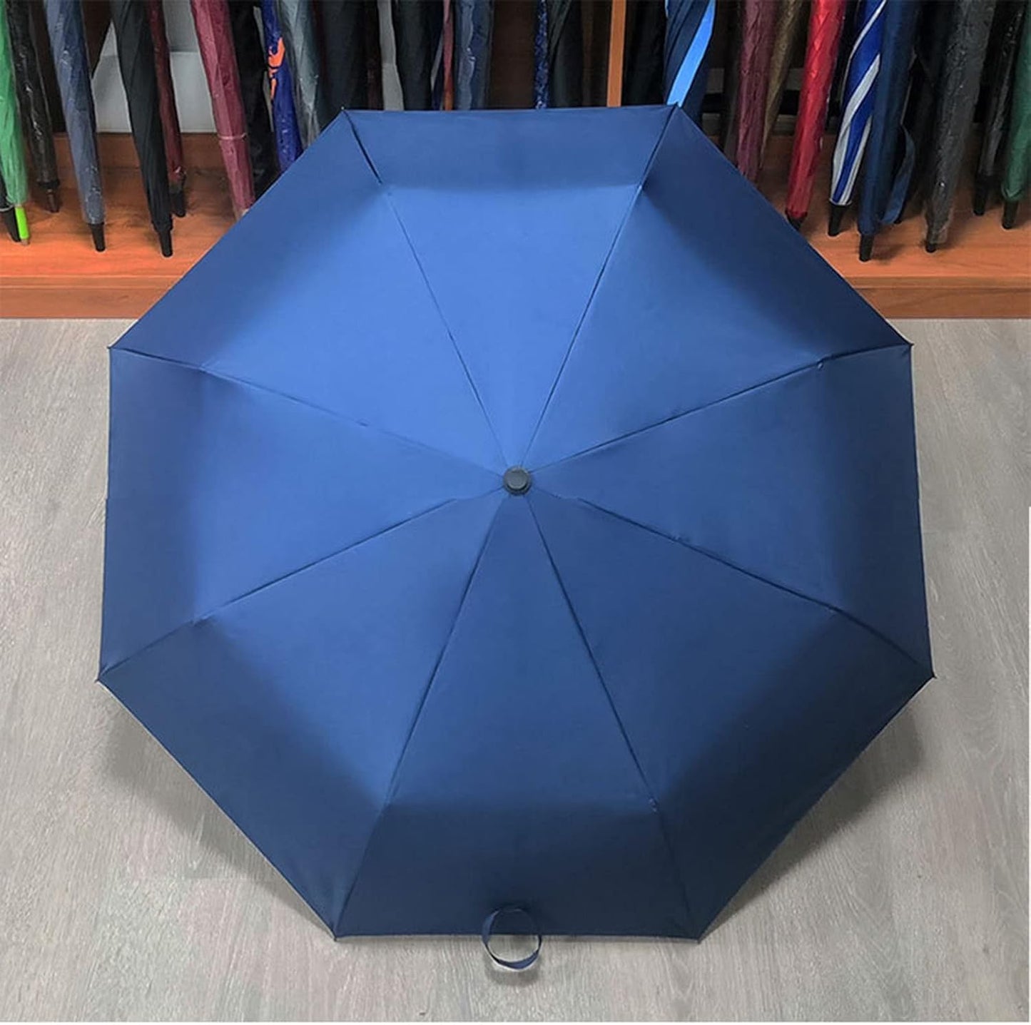 Travel windproof foldable blue umbrella – compact and durable design, perfect for on-the-go protection from rain and wind, easy to fold and store, features a strong, wind-resistant frame, ideal for travel, daily use, and outdoor activities.