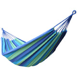 Durable cotton canvas hammock with tree straps – strong and comfortable design for outdoor and indoor relaxation, breathable fabric for ultimate comfort, easy to set up, perfect for camping, backyard, patio, or travel.